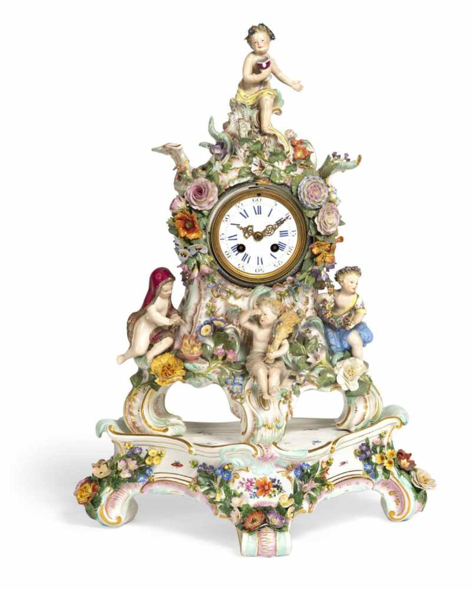 A MEISSEN FLORAL PATTERN PORCELAIN PENDULE AND STAND, c. 1860/80. Rocaille shaped, 4 putti depicting