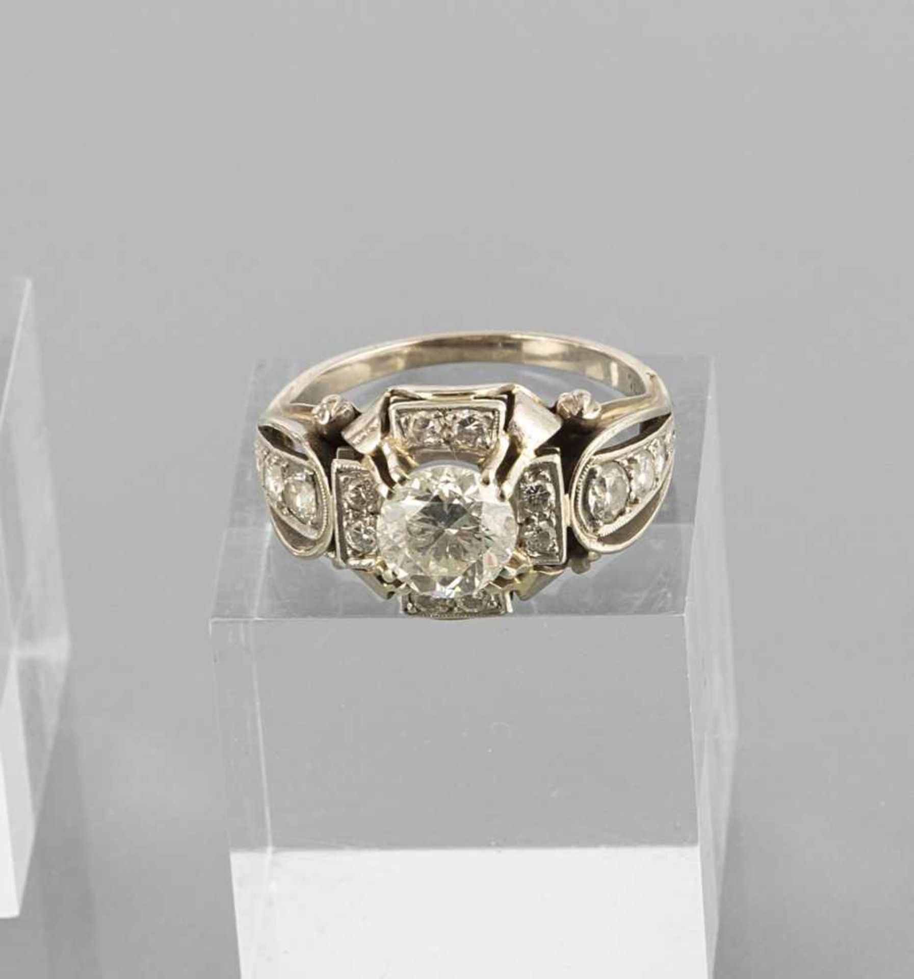 DIAMOND RING, c. 1960ies. 750 white gold, central brilliant c. 1,3 ct. (c. K-M/p3, minor damage) and