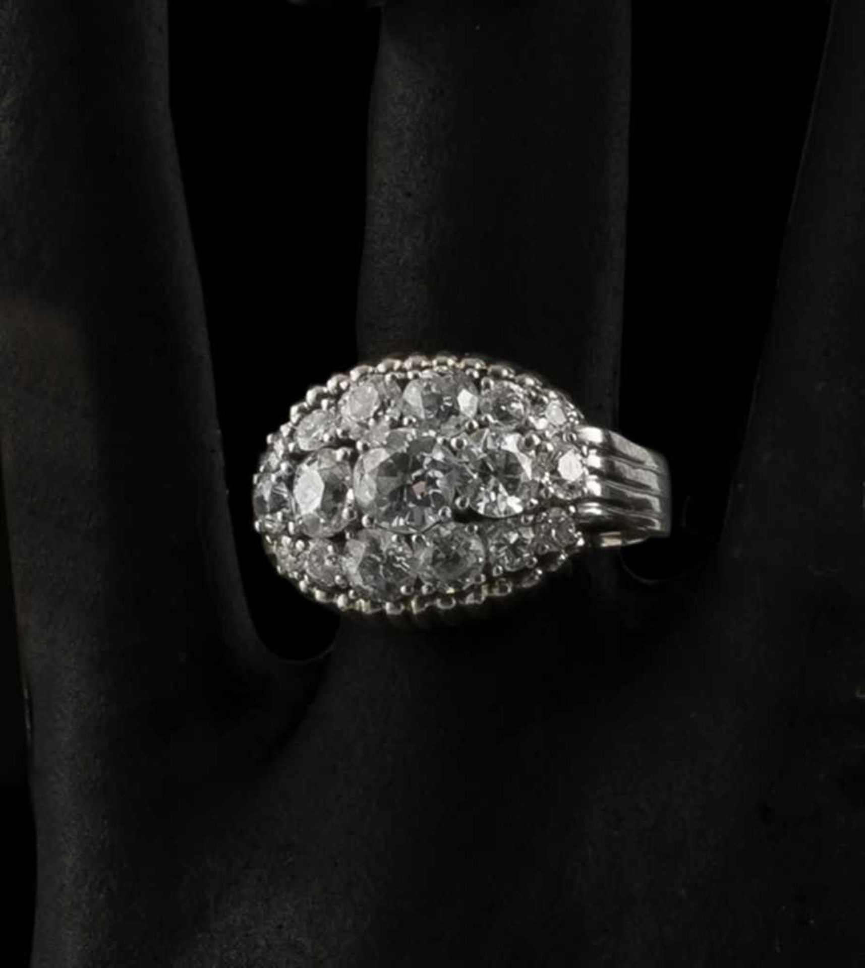 A DIAMOND RING, c. 1960ies. 750 white gold, 17 old-cut diamonds (tog.c. 3 ct.). Total weight c. 15,7