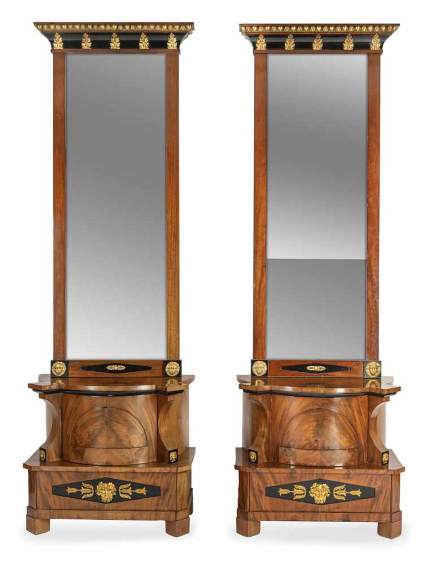 An opulent pair of Biedermeier mahogany commodes and mirrors (one mirror later), North Germany, c.