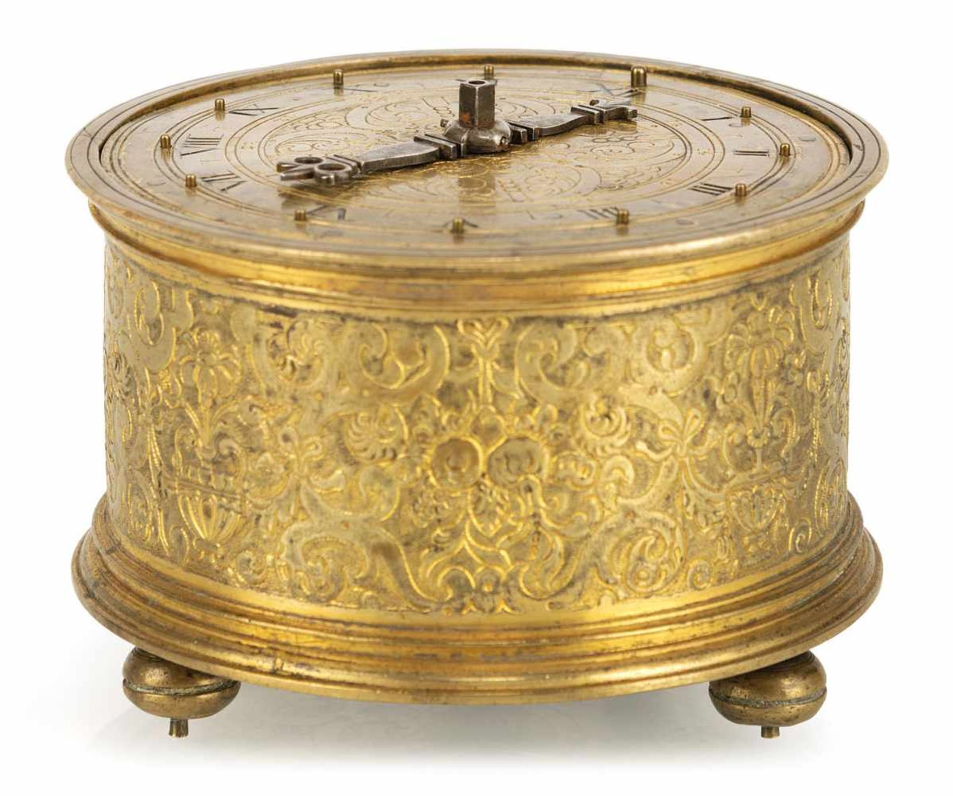 A round fire-gilt table clock, stamped NS ( Nikolaus Schmidt Augsburg ?), c. 1620. Engraved and