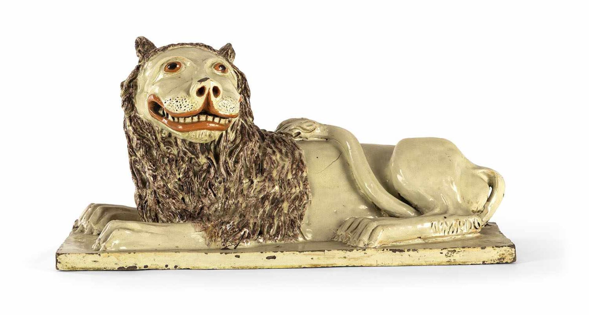 A BIG RECUMBAND GLAZED TERRACOTTA LION, probably pottery workshop of Michael Schroeck, Mariakirchen,