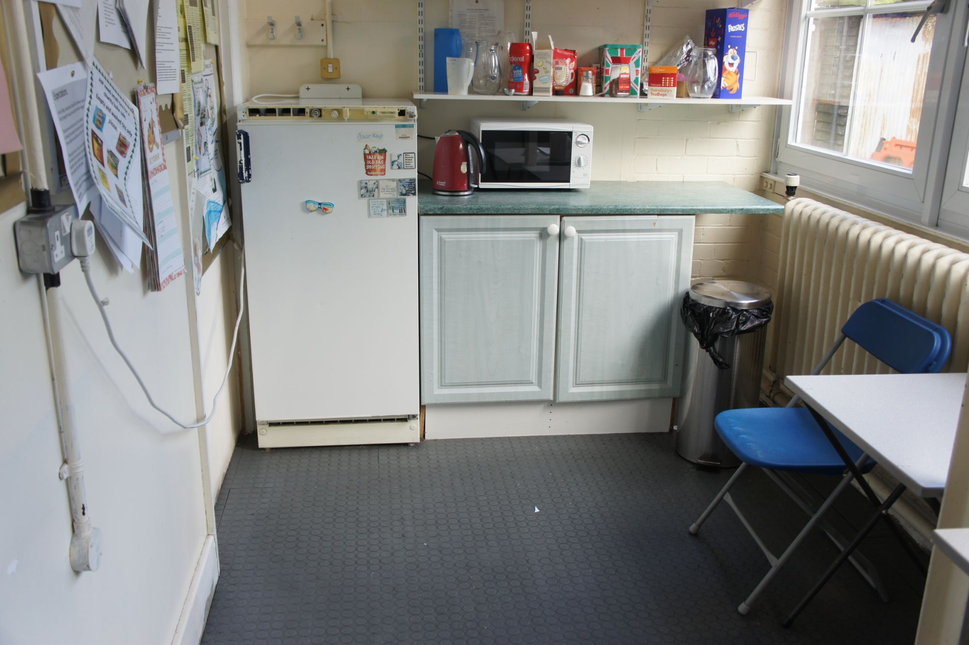 Contents of room comprising, fridge, Russell Hobbs kettle, microwave, folding chair, 2 x folding ta