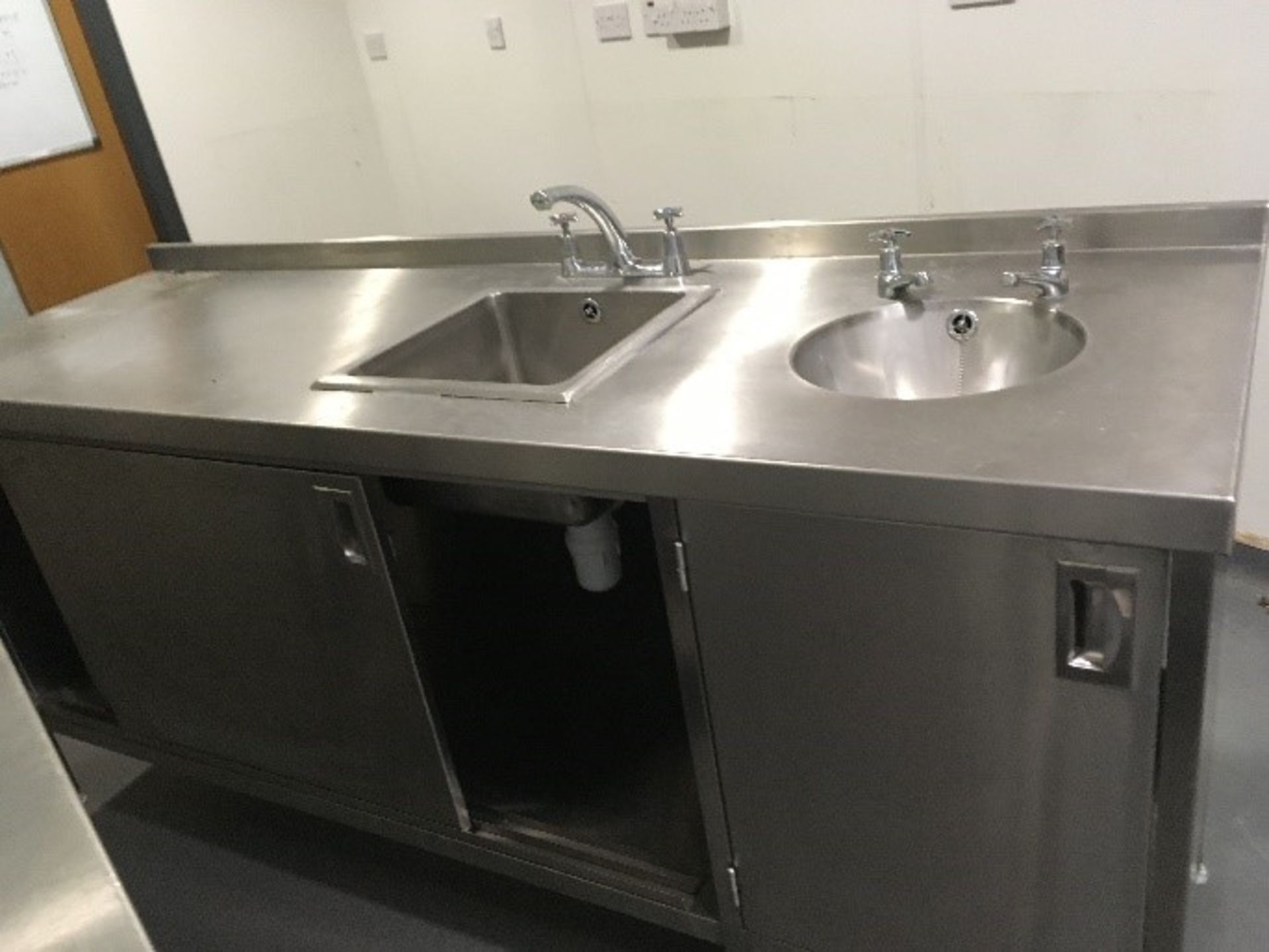 Stainless steel sink unit with cupboards