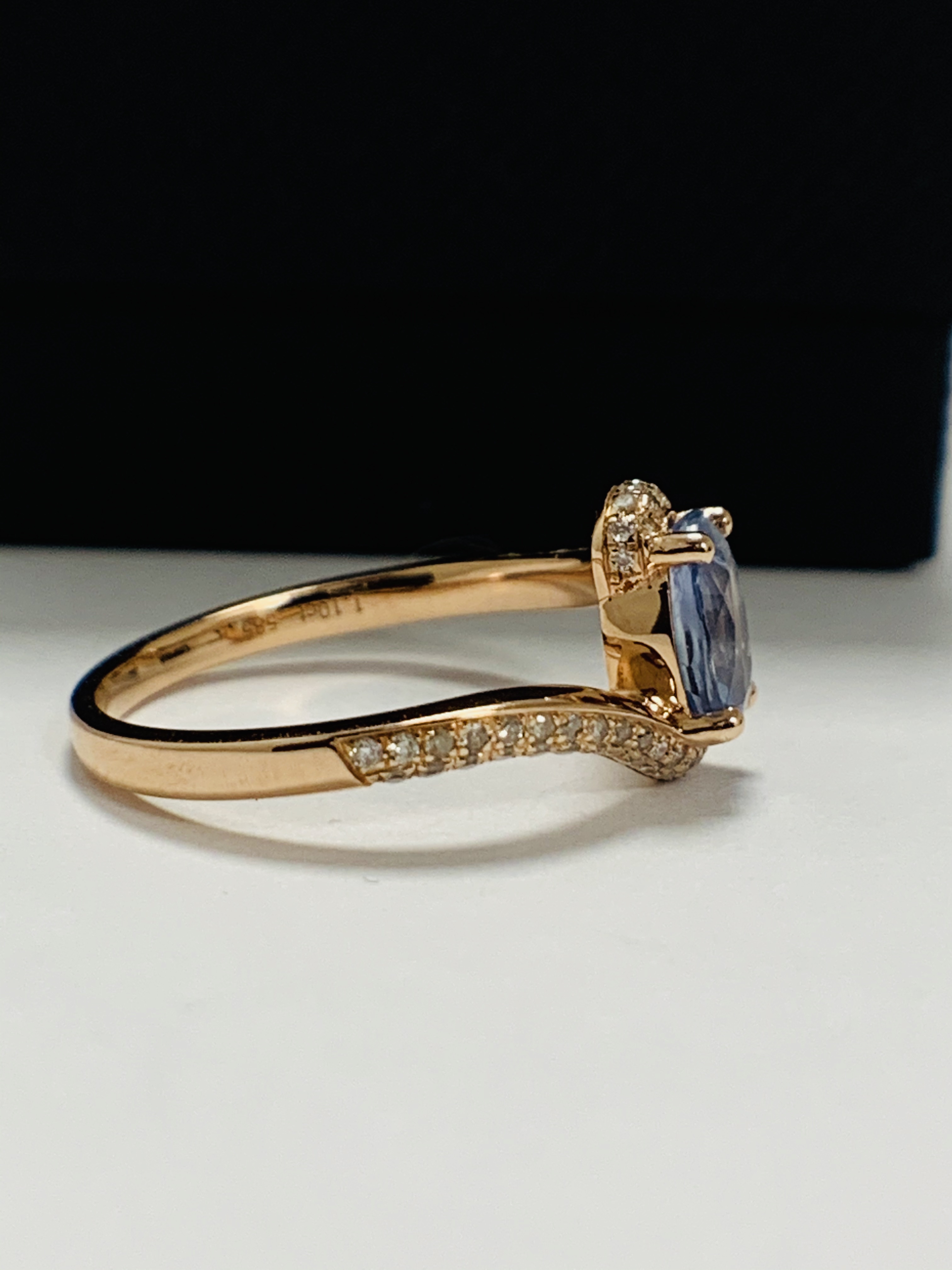 14ct Rose Gold Sapphire and Diamond ring featuring centre, oval cut, blue Sapphire (1.10ct), claw se - Image 8 of 13