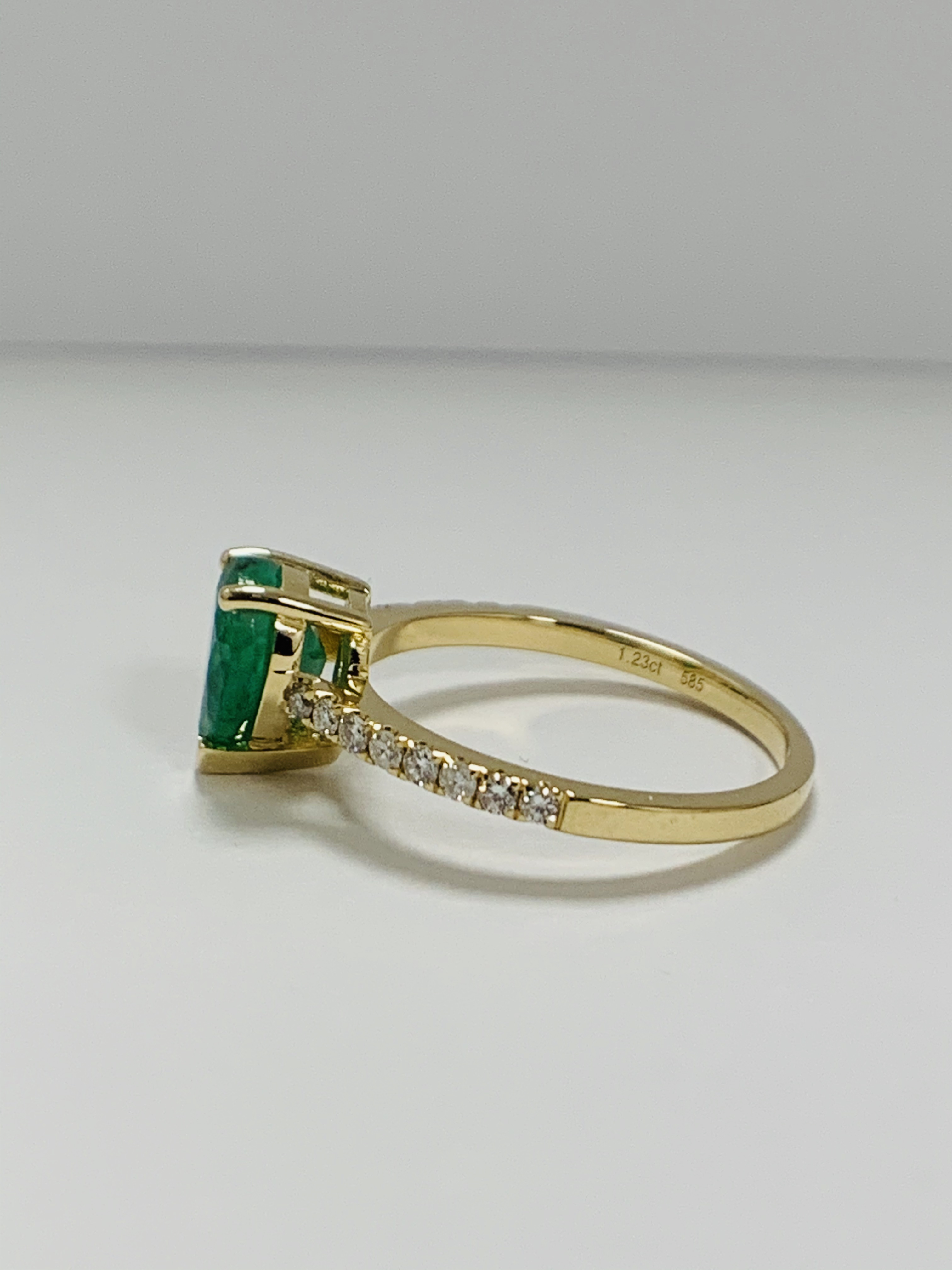 14ct Yellow Gold Emerald and Diamond ring featuring centre, pear cut, medium green Emerald (1.23ct), - Image 2 of 10