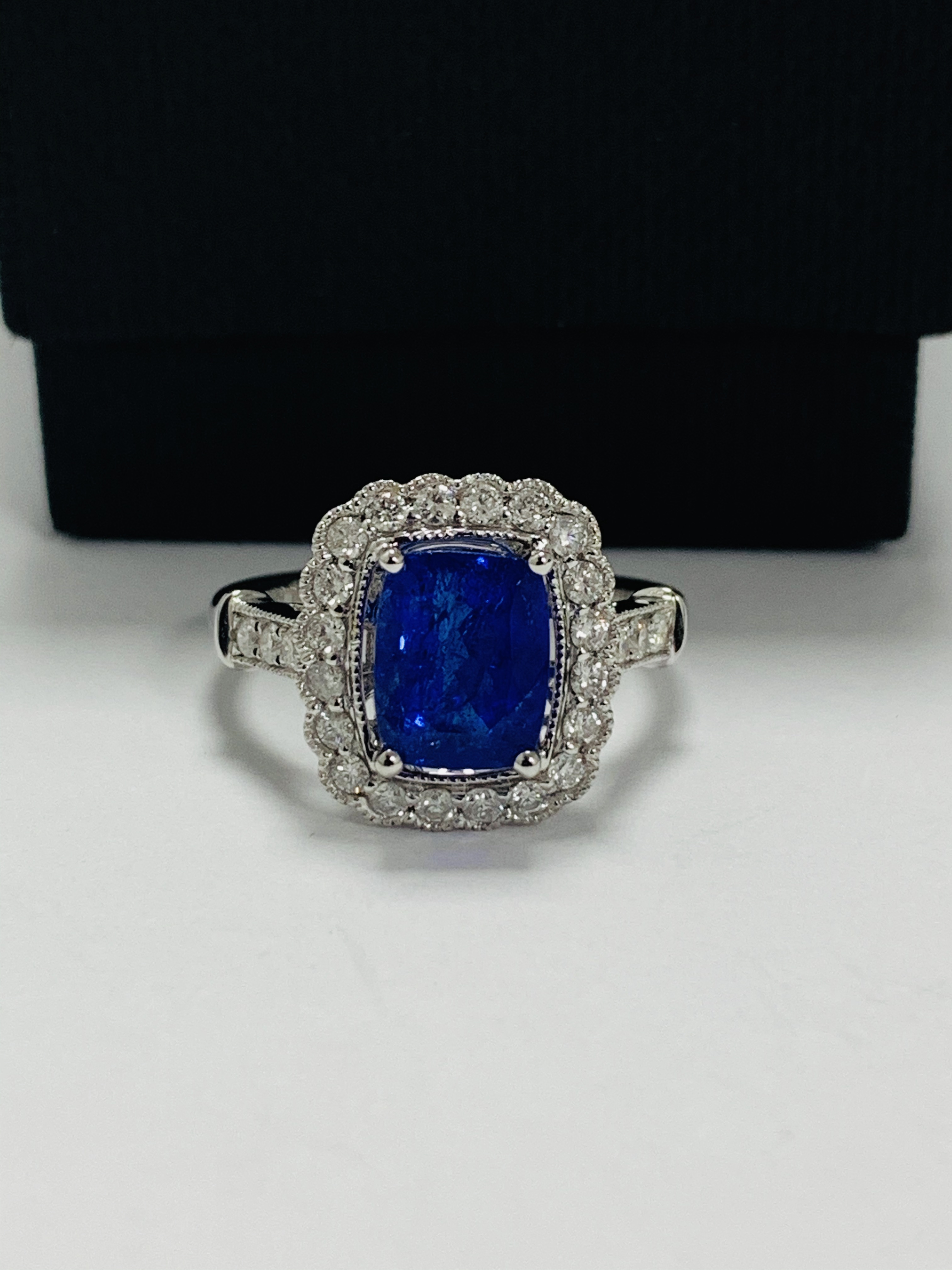 18ct White Gold Tanzanite and Diamond ring featuring centre, cushion cut Tanzanite (2.66ct), claw se