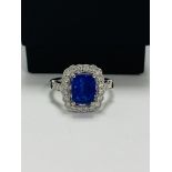 18ct White Gold Tanzanite and Diamond ring featuring centre, cushion cut Tanzanite (2.66ct), claw se