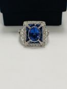 18ct White Gold Tanzanite, sapphire and Diamond ring featiurngg centre, oval cut Tanzanite (0.84ct),