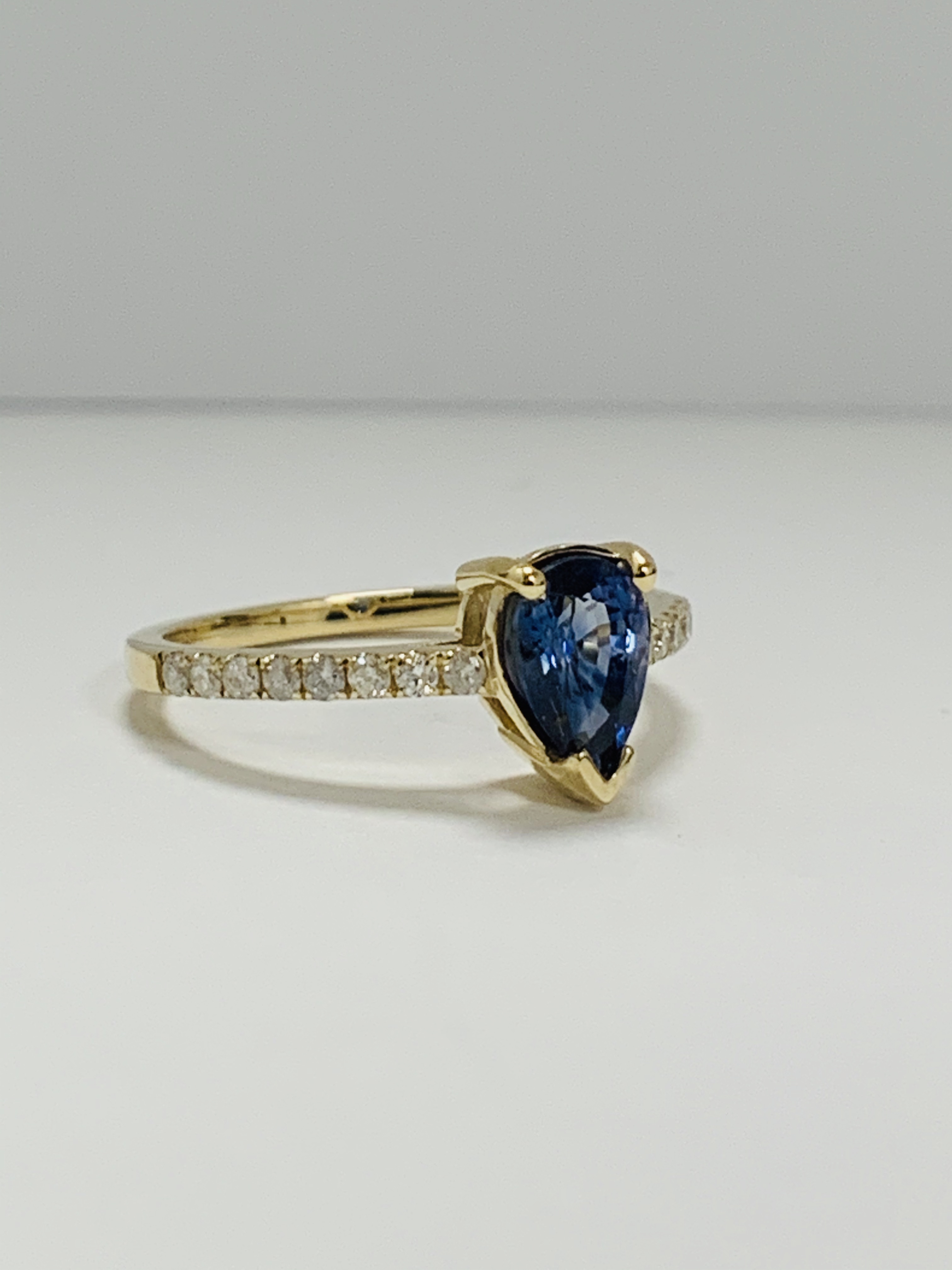 14ct Yellow Gold Sapphire and Diamond ring featuring centre, pear cut, medium blue Sapphire (0.90ct) - Image 7 of 13