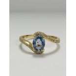 14ct Yellow Gold Sapphire and Diamond ring featuring centre, oval cut, light blue Sapphire (0.77ct),