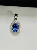 14ct white gold tanzanite & diamond pendant.