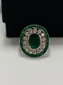 18ct White Gold Emerald and Diamond ring featuring centre, oval cut, green Emerald (2.06ct), claw se