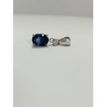 14ct White Gold Sapphire and Diamond pendant featuring oval cut, medium blue Sapphire (1.31ct), 4-cl