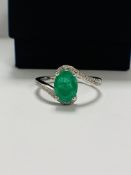 14ct White Gold Emerald and Diamond ring featuring centre, oval cut, medium green Emerald (1.18ct),