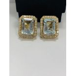 14ct Yellow Gold Aqumarine and Diamond stud earrings featuring, 2 emerald cut Aquamarines (13.00ct T