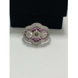 18ct White Gold Sapphire and Diamond ring featuring centre, 3 round brilliant cut Diamonds (0.50ct),