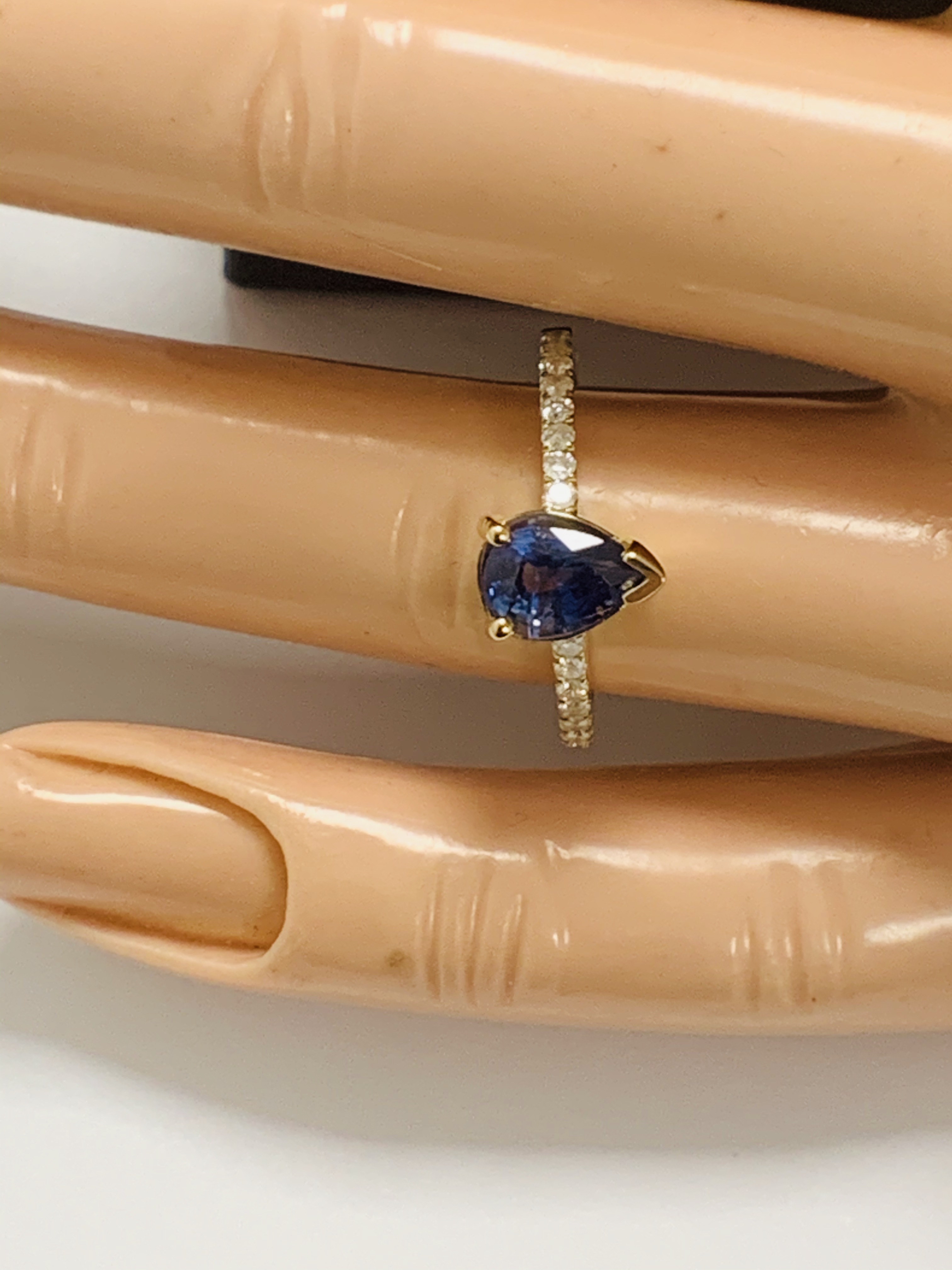 14ct Yellow Gold Sapphire and Diamond ring featuring centre, pear cut, medium blue Sapphire (0.90ct) - Image 9 of 13