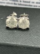 14ct White Gold Diamond stud earrings featuring, 2 round brilliant cut Diamonds (2.03ct TDW), 4-claw
