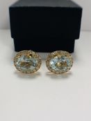 14ct Yellow Gold Aquamarine and Diamond stud earrings featuring, 2 oval cut Aquamarines (8.22ct TSW)
