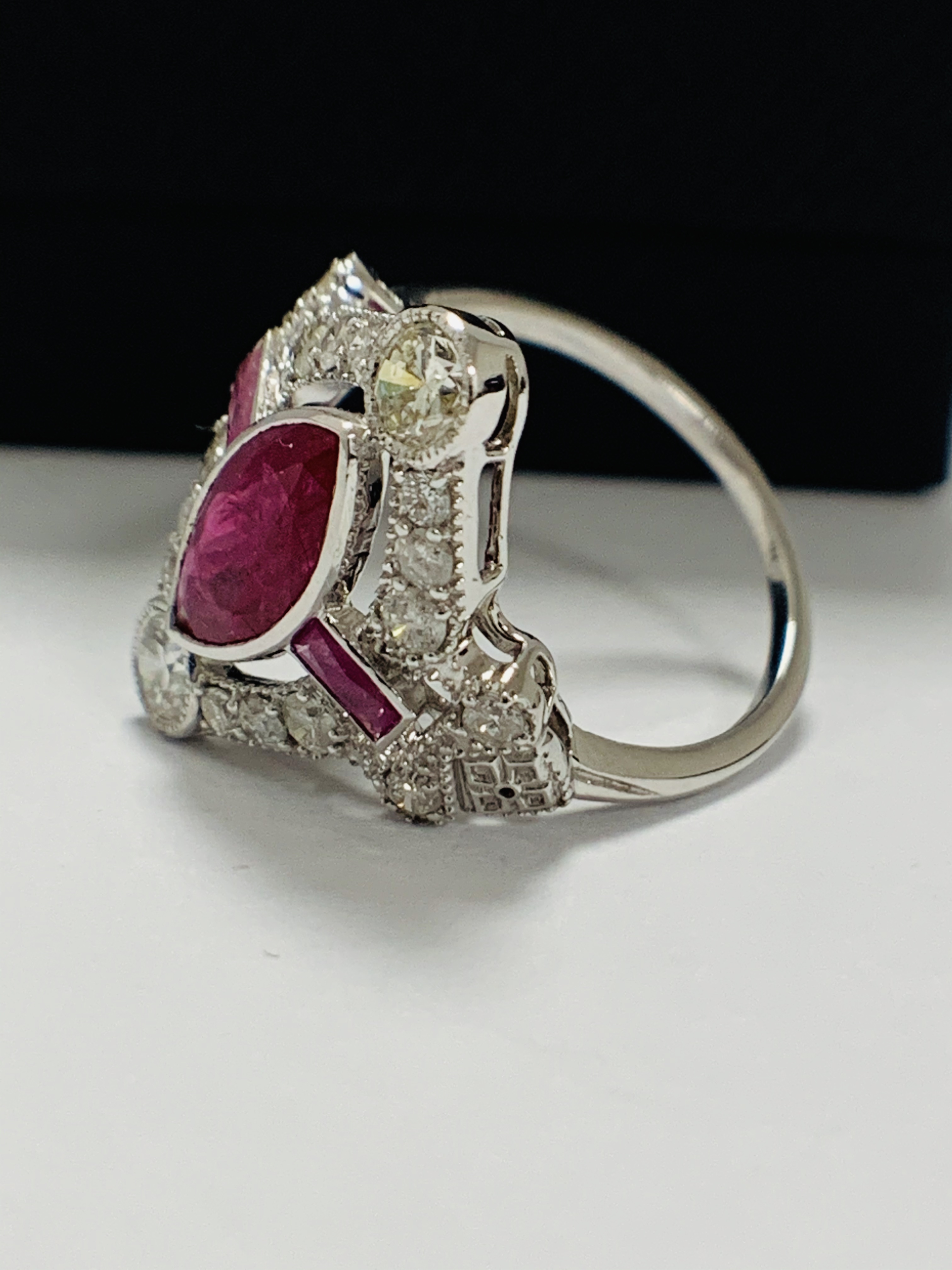 18ct White Gold Ruby and Diamond ring featuring centre, marquise cut, Natural Ruby (1.34ct), claaw s - Image 3 of 13