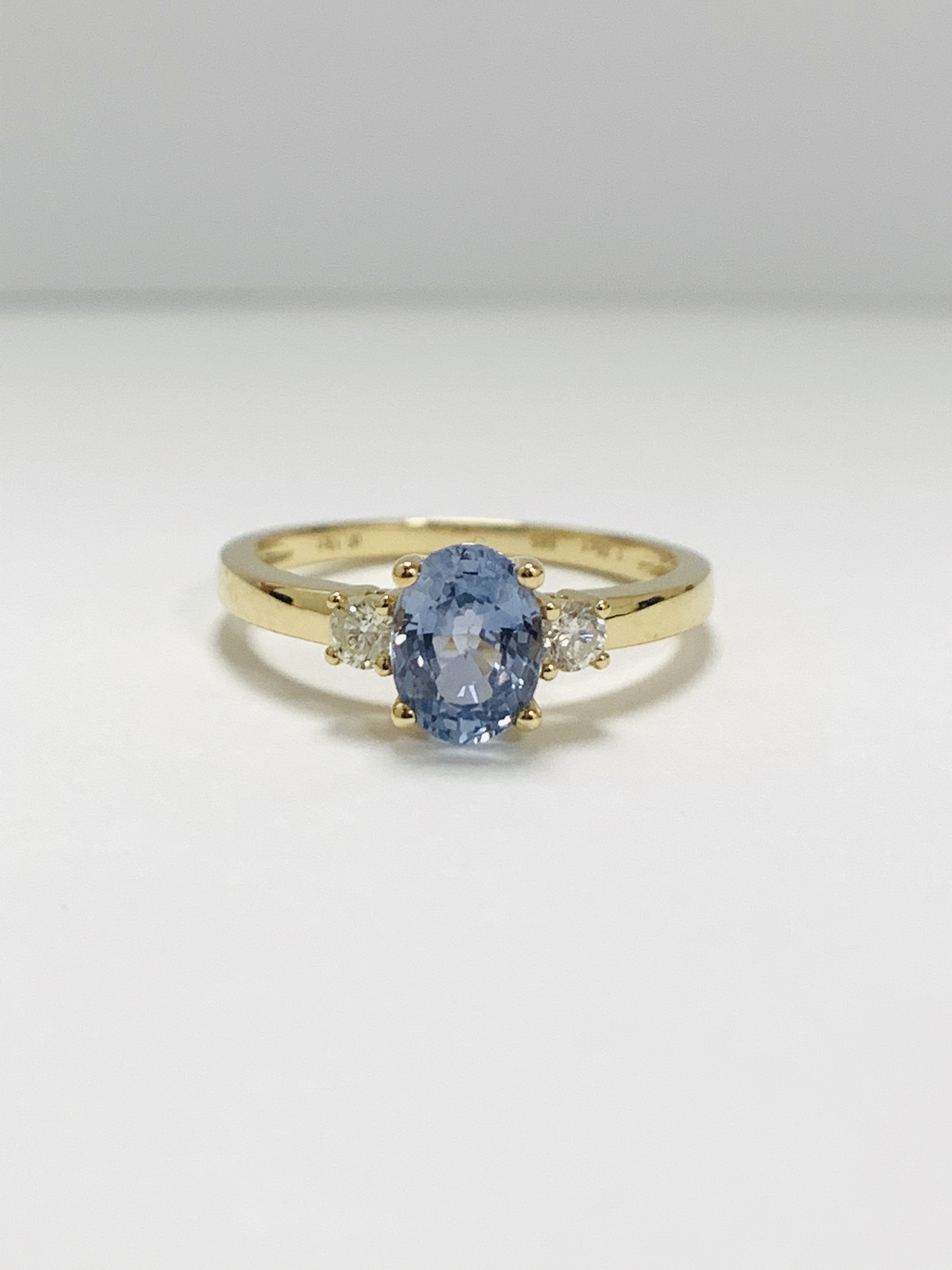 14ct Yellow Gold Sapphire and Diamond ring featuring centre, oval cut, medium blue Sapphire (1.05ct)