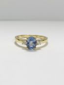 14ct Yellow Gold Sapphire and Diamond ring featuring centre, oval cut, medium blue Sapphire (1.05ct)