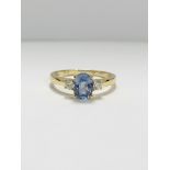 14ct Yellow Gold Sapphire and Diamond ring featuring centre, oval cut, medium blue Sapphire (1.05ct)