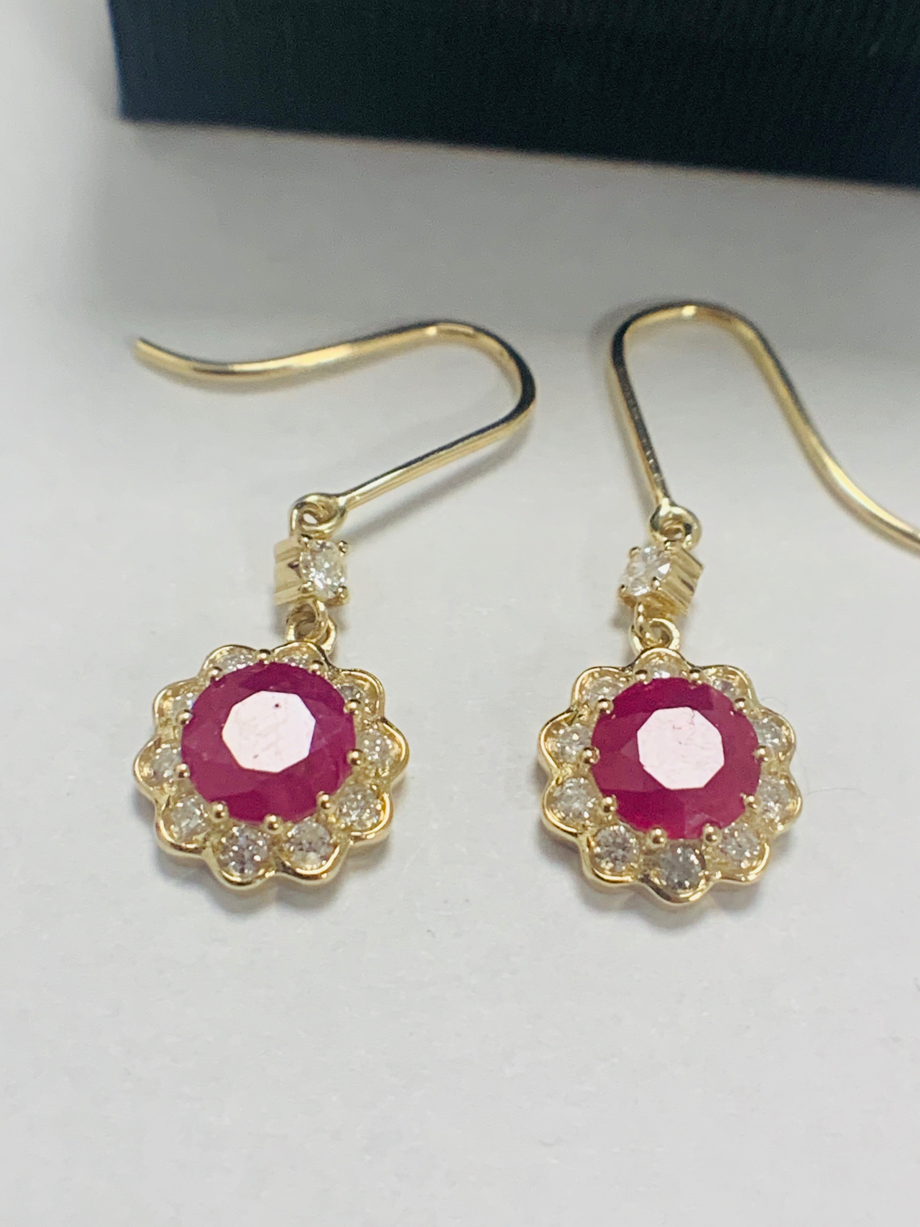 14ct Yellow Gold Ruby and Diamond earrings featuring, 2 round cut, red Rubies (2.22ct TSW)