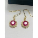 14ct Yellow Gold Ruby and Diamond earrings featuring, 2 round cut, red Rubies (2.22ct TSW)