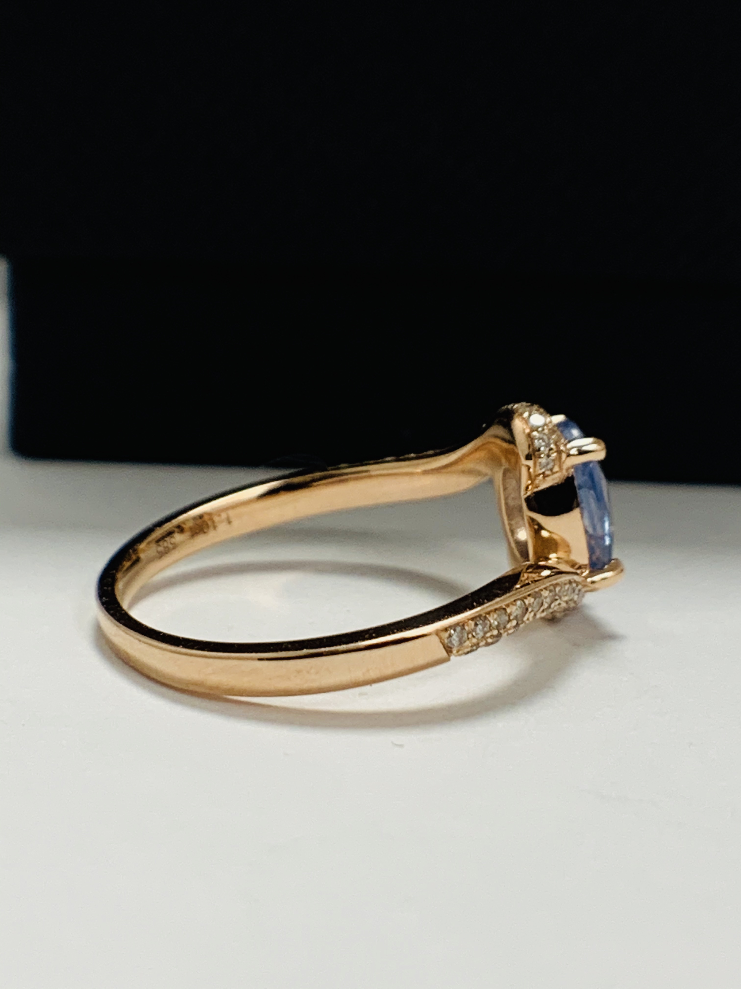 14ct Rose Gold Sapphire and Diamond ring featuring centre, oval cut, blue Sapphire (1.10ct), claw se - Image 6 of 13