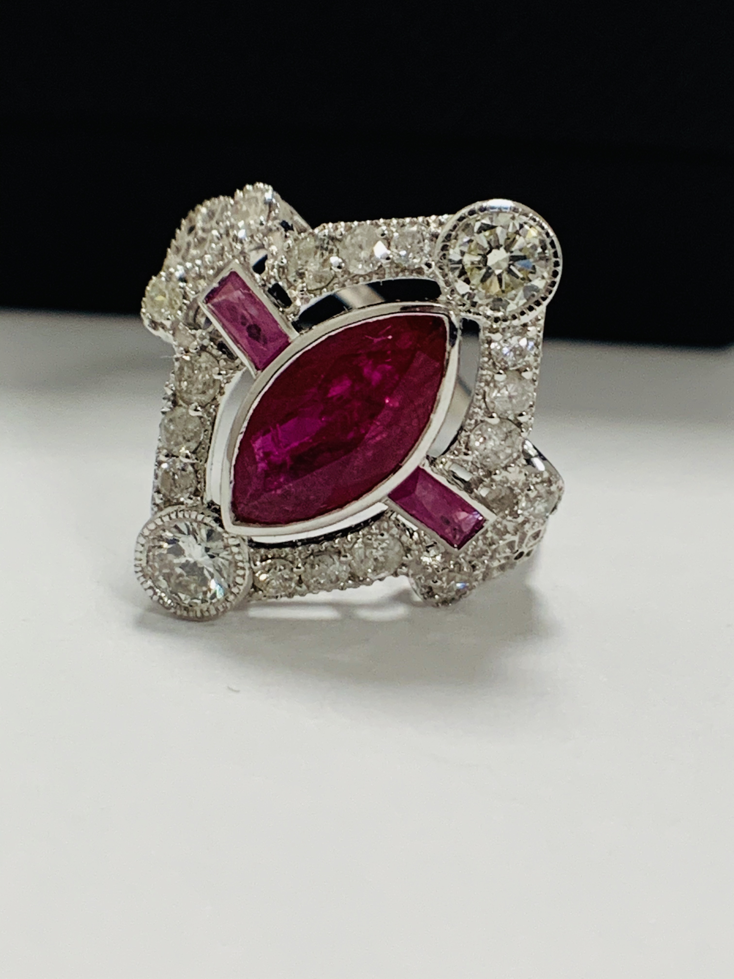 18ct White Gold Ruby and Diamond ring featuring centre, marquise cut, Natural Ruby (1.34ct), claaw s - Image 2 of 13