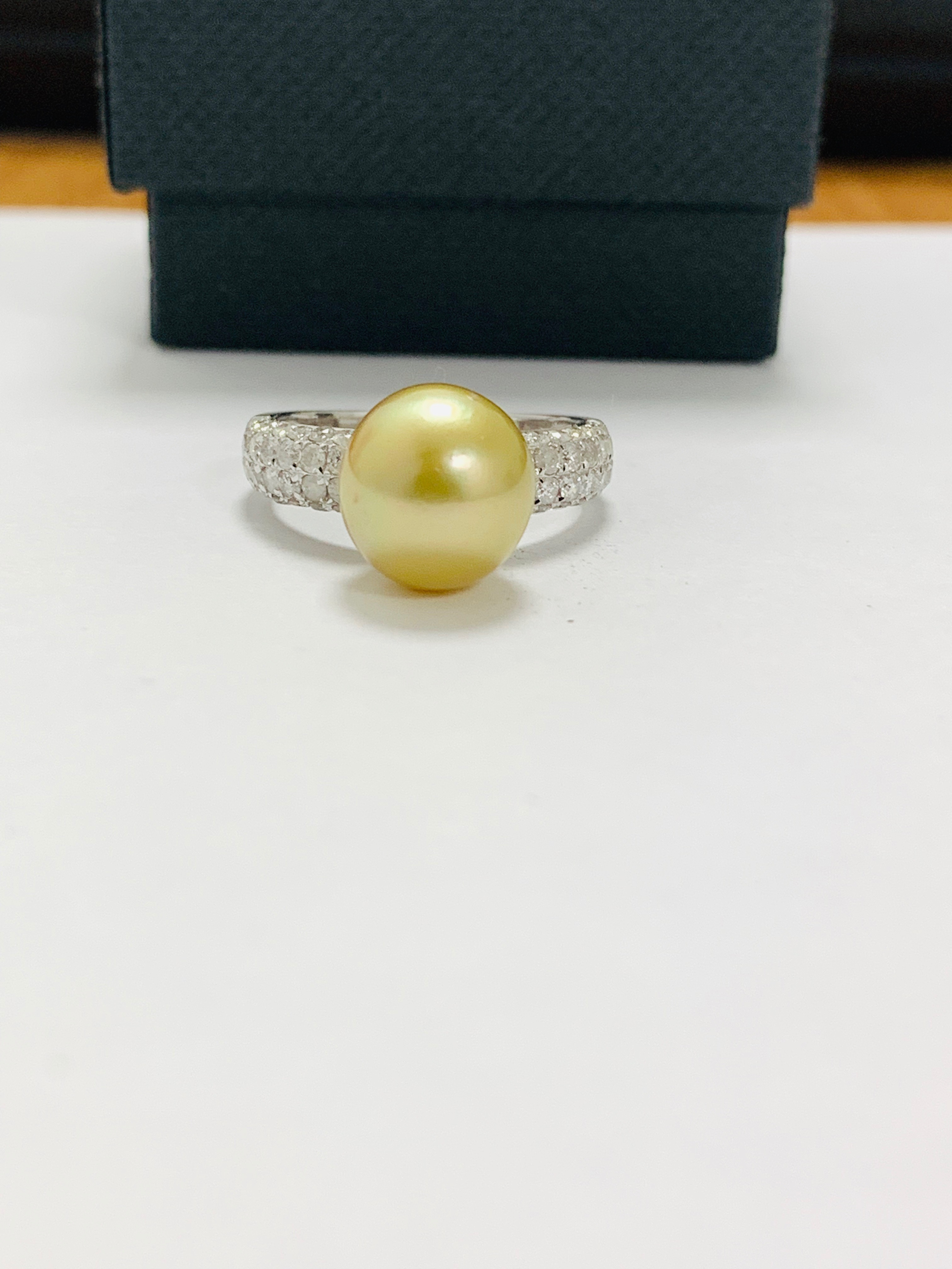 14ct white gold pearl & diamond ring.