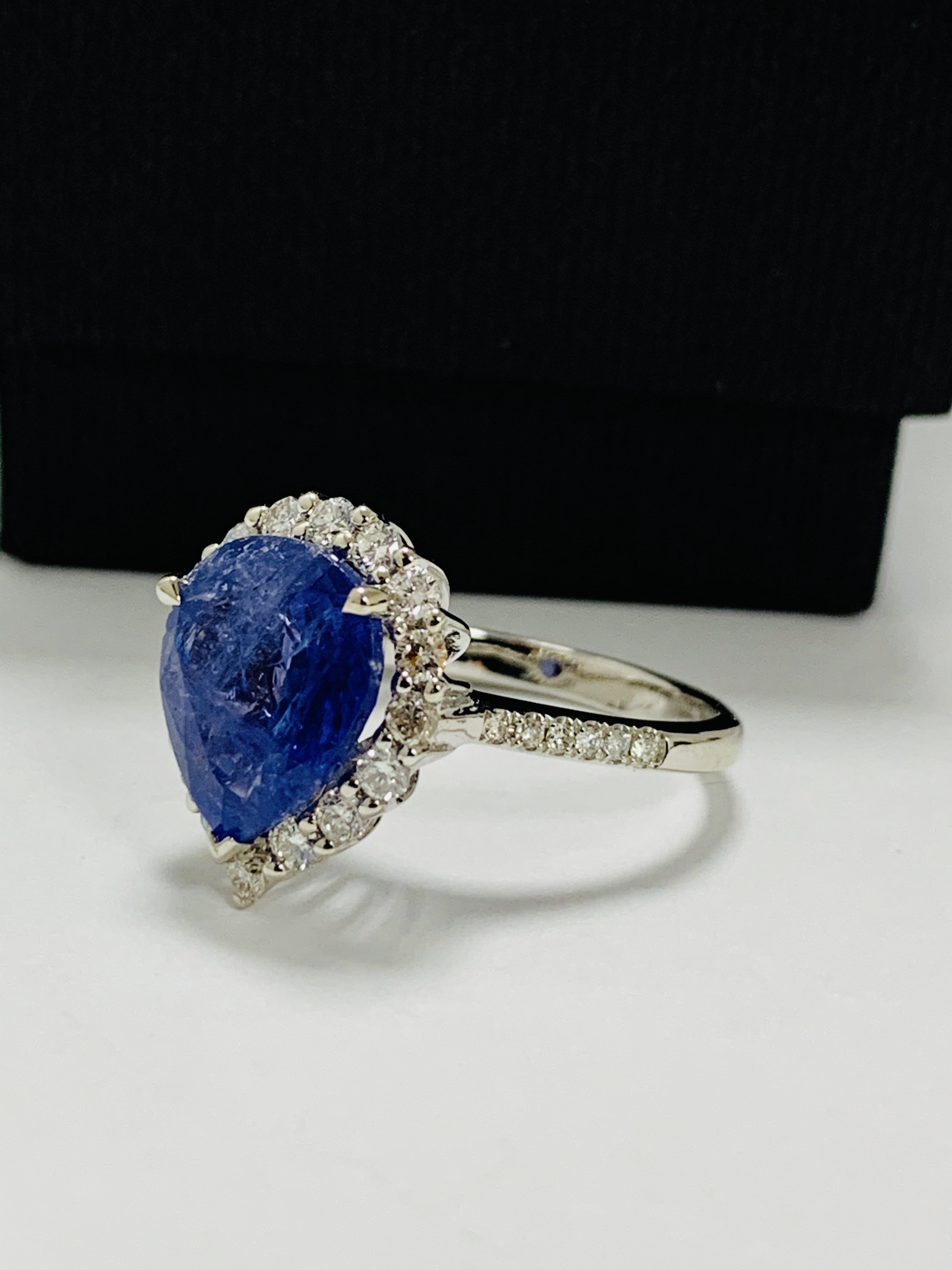 14ct White Gold Tanzanite and Diamond ring featuring, pear cut Tanzanite (4.17ct), claw set, with 28 - Image 2 of 13