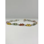 14ct White Gold Sapphire and Diamond bracelet featuring, 22 pear cut, yellow, green and orange Sapph