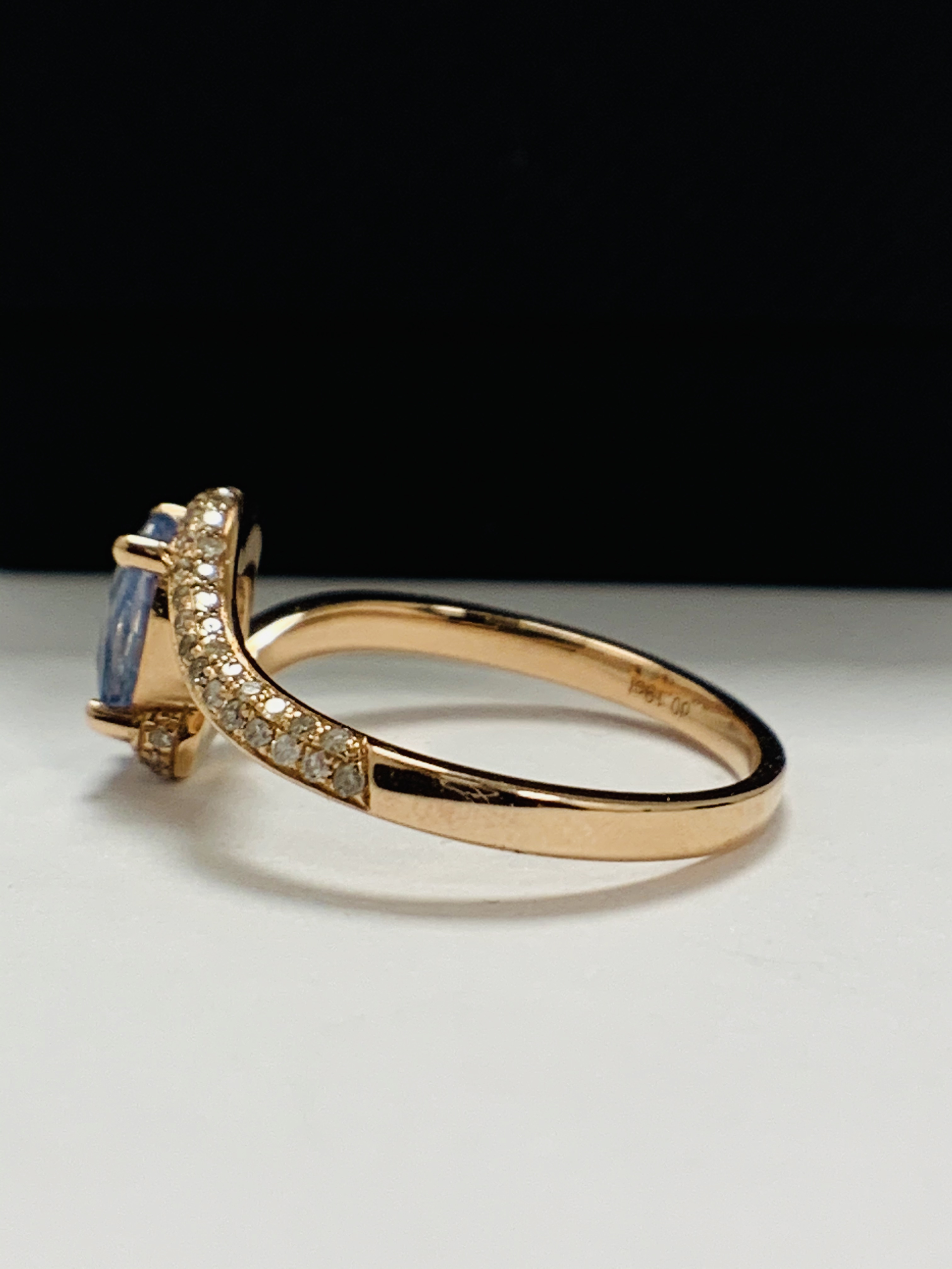 14ct Rose Gold Sapphire and Diamond ring featuring centre, oval cut, blue Sapphire (1.10ct), claw se - Image 4 of 13