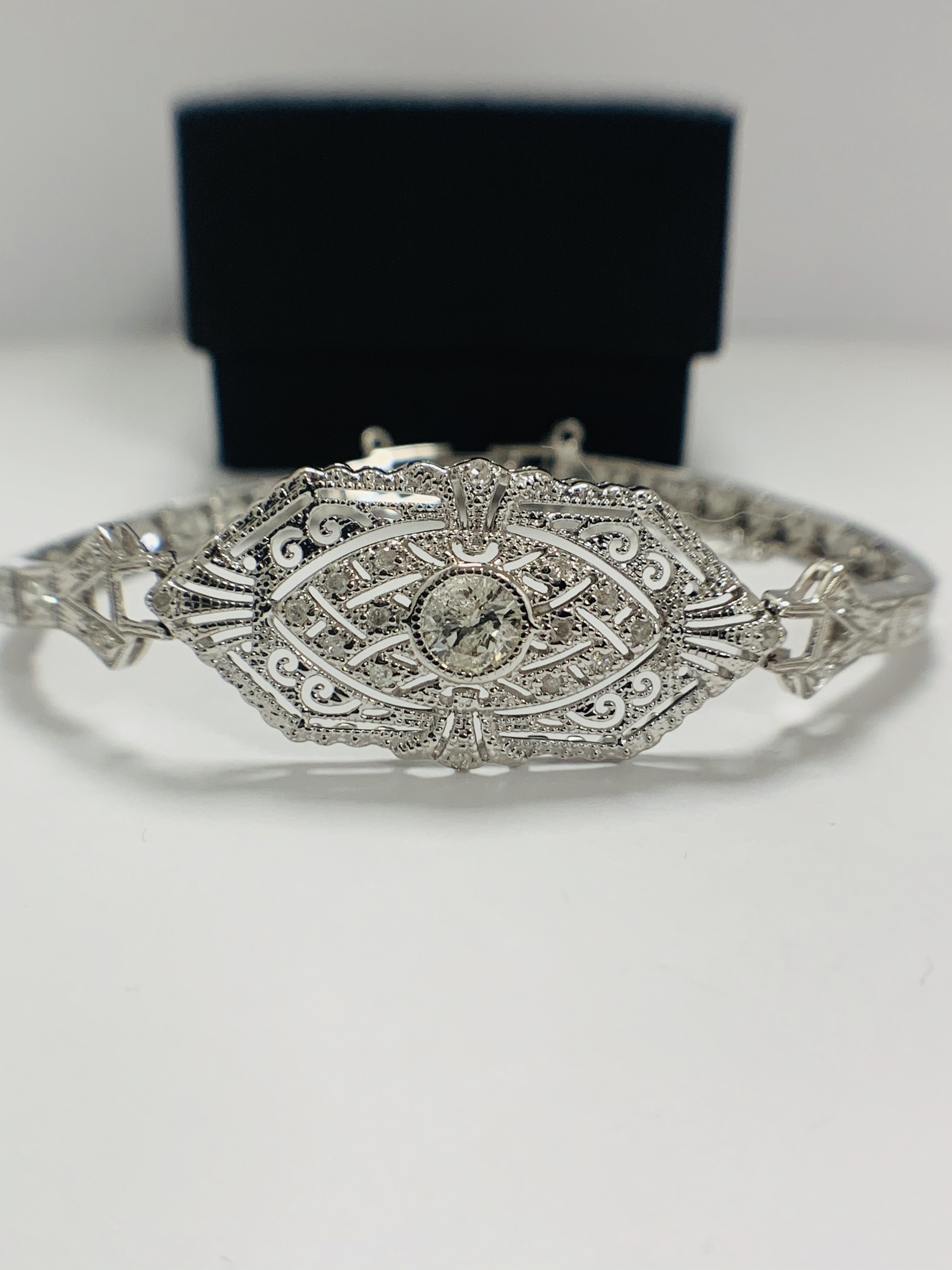 Platinum Diamond bracelet featuring, one round brilliant cut Diamond (0.43ct), with 49 round brillia