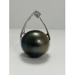 14ct White Gold Pearl and Diamond pendant featuring, round brilliant cut Diamond (0.06ct), grain set