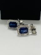 14ct White Gold Sapphire and Diamond drop earrings featuring, emerald cut, vivid blue Sapphires (2.1