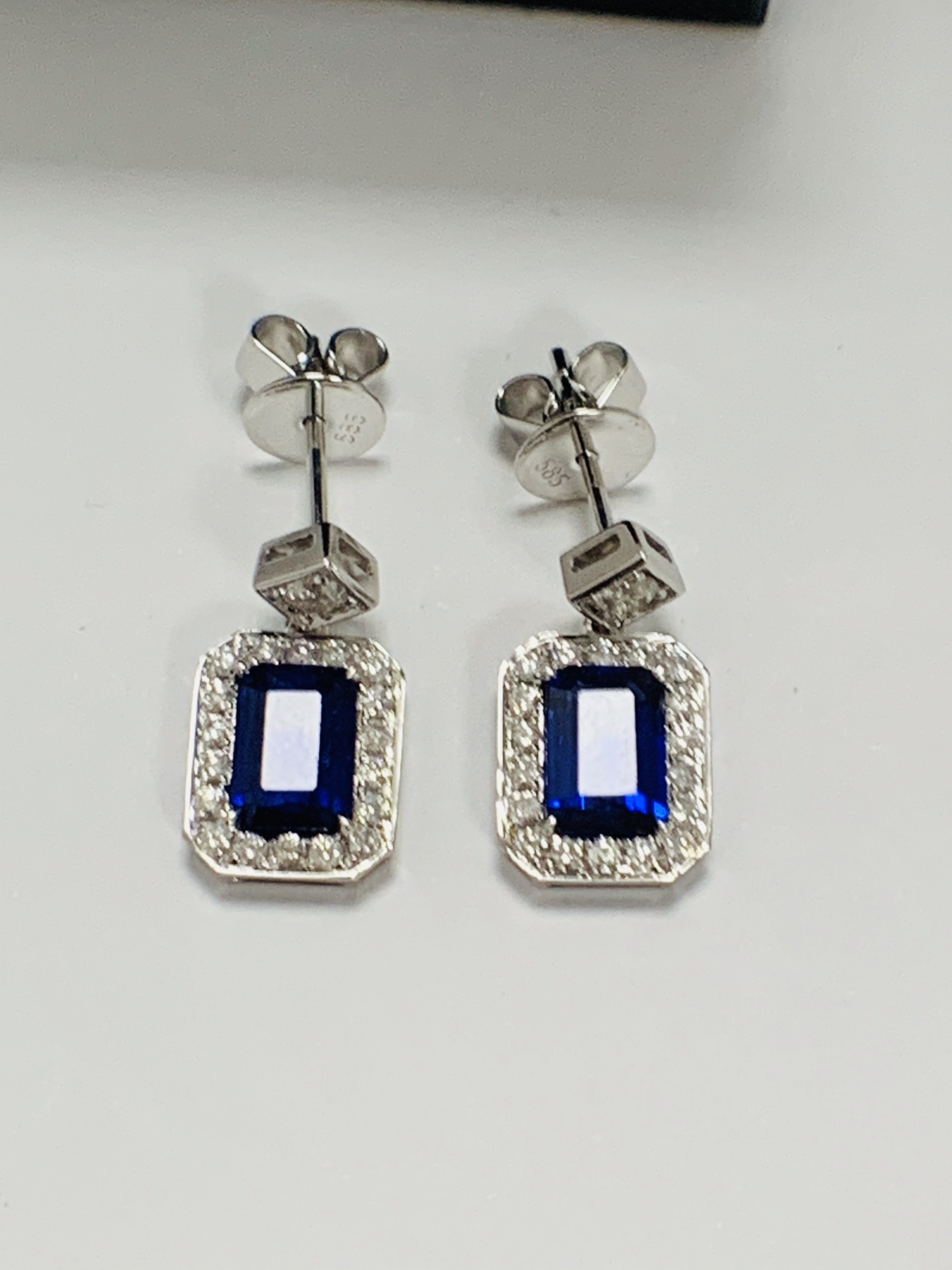 14ct White Gold Sapphire and Diamond drop earrings featuring, emerald cut, vivid blue Sapphires (2.1 - Image 7 of 15