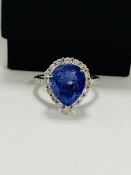 14ct White Gold Tanzanite and Diamond ring featuring, pear cut Tanzanite (4.17ct), claw set, with 28