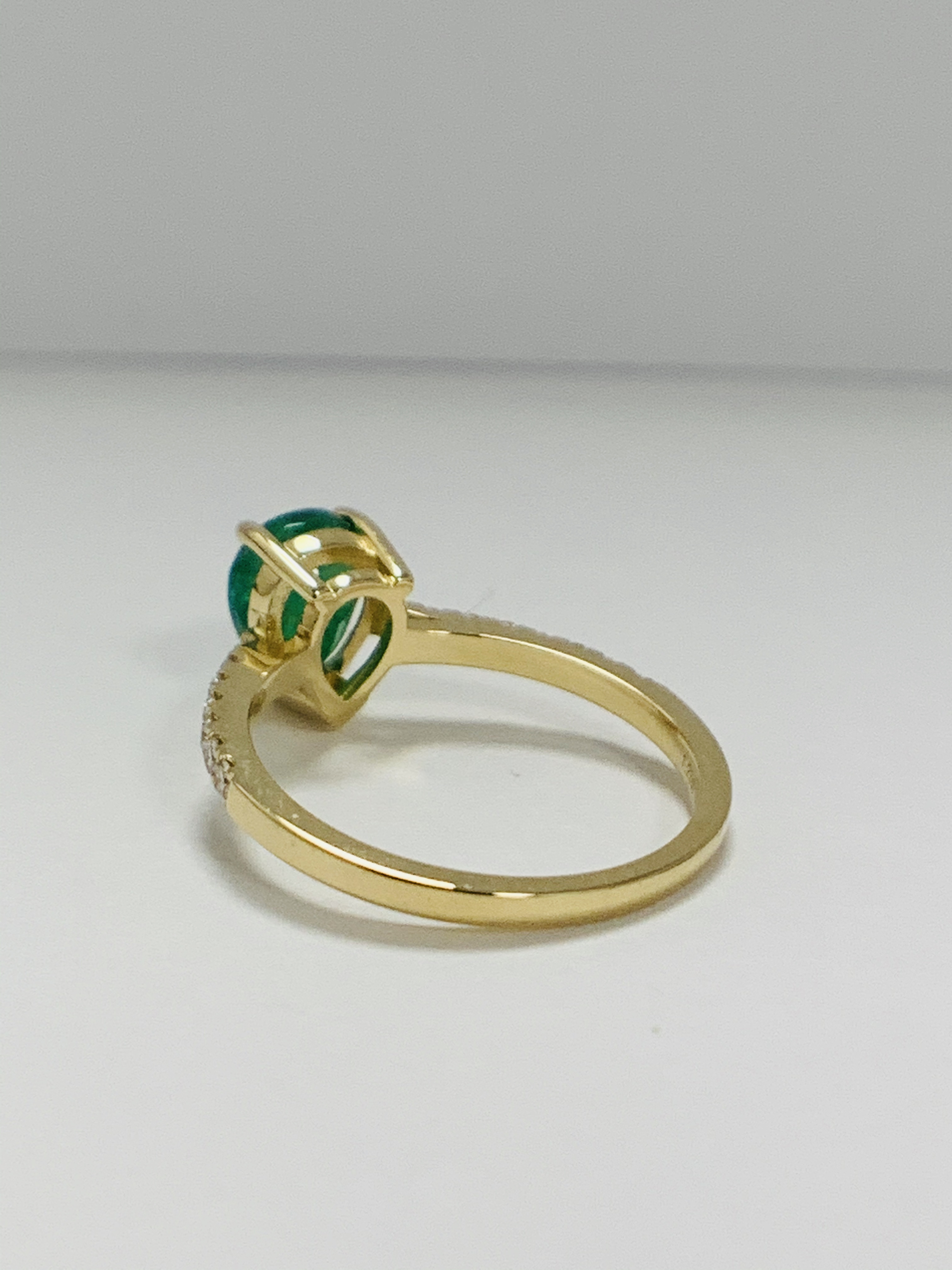 14ct Yellow Gold Emerald and Diamond ring featuring centre, pear cut, medium green Emerald (1.23ct), - Image 3 of 10