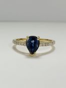 14ct Yellow Gold Sapphire and Diamond ring featuring centre, pear cut, medium blue Sapphire (0.90ct)