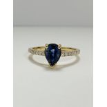 14ct Yellow Gold Sapphire and Diamond ring featuring centre, pear cut, medium blue Sapphire (0.90ct)