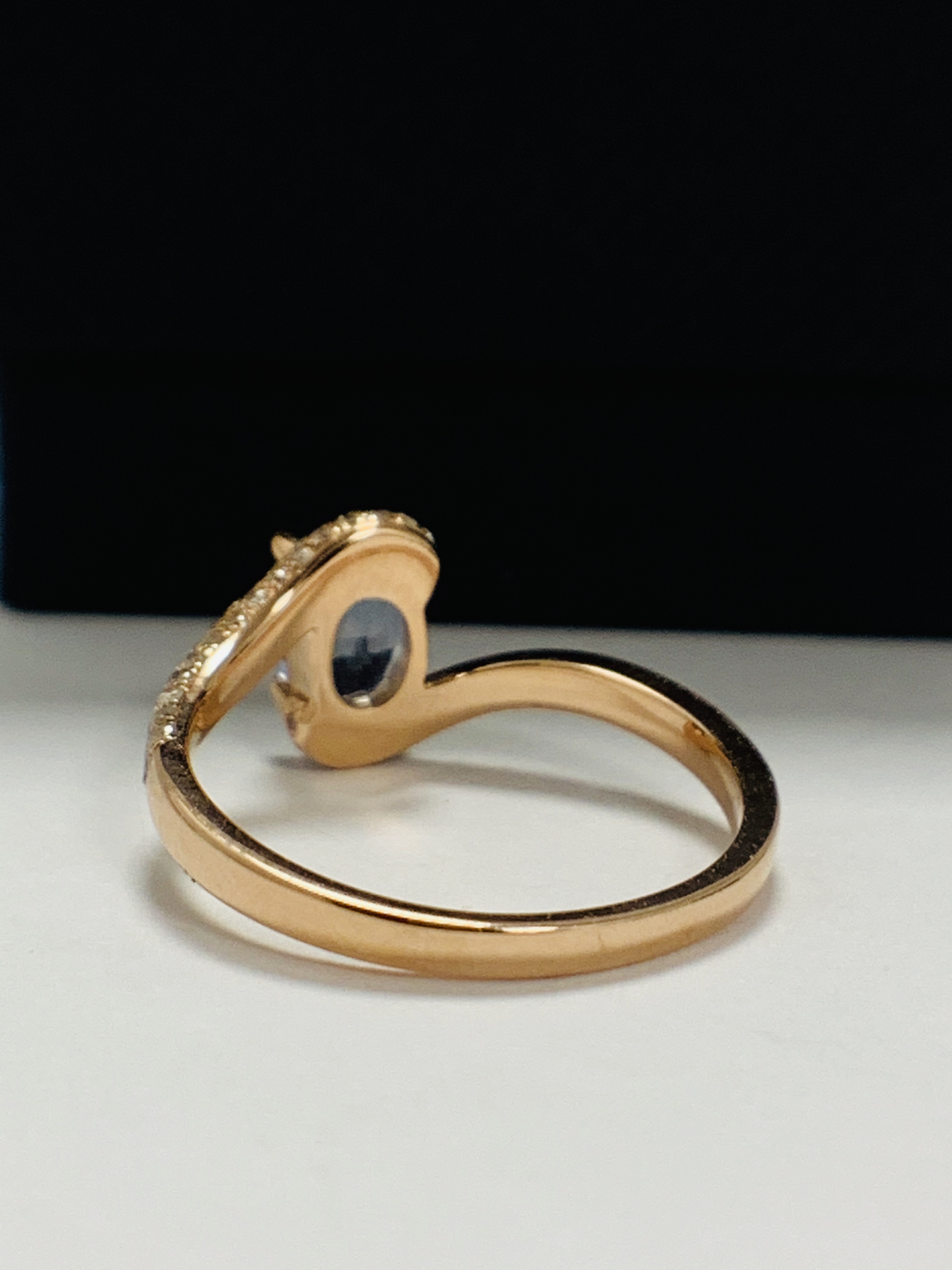 14ct Rose Gold Sapphire and Diamond ring featuring centre, oval cut, blue Sapphire (1.10ct), claw se - Image 5 of 13