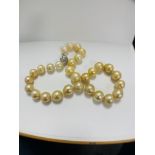 Pearl and Diamond necklace strand featuring, 33 South Sea Pearls, with 4 round brilliant cut Diamond