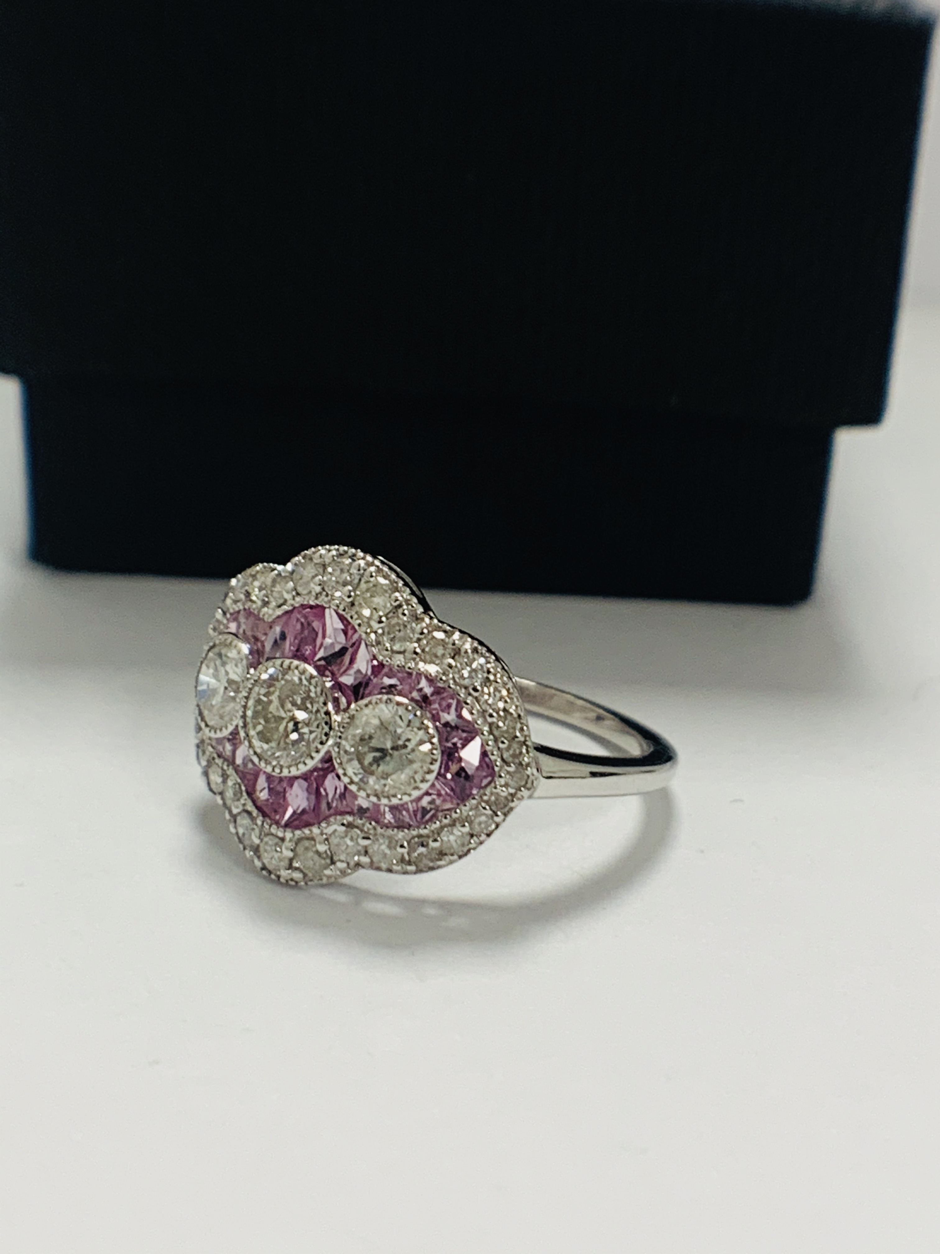 18ct White Gold Sapphire and Diamond ring featuring centre, 3 round brilliant cut Diamonds (0.50ct), - Image 2 of 11