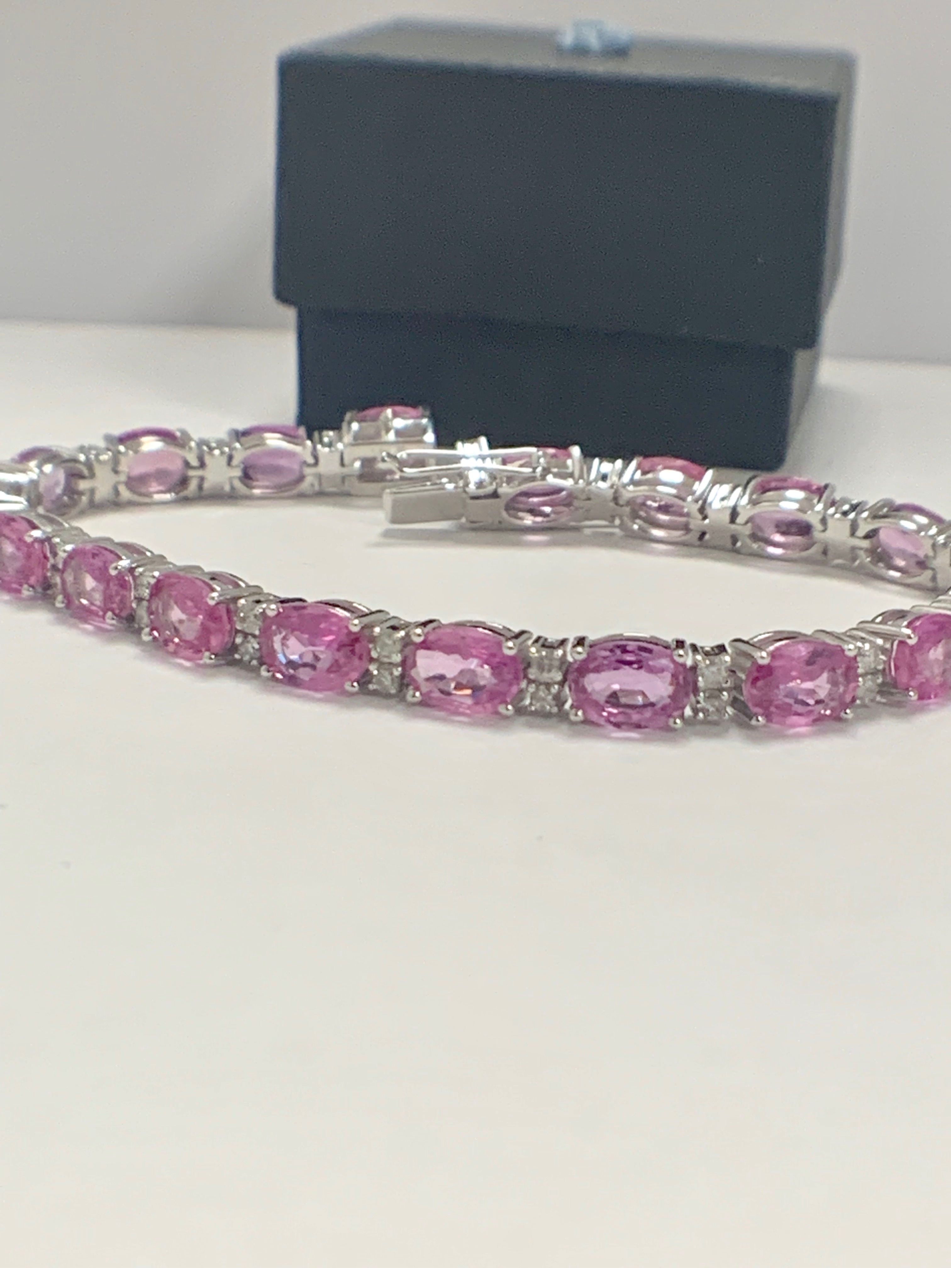 14ct White Gold Sapphire and Diamond bracelet featuring, 19 oval cut, pink Sapphires (15.93ct TSW)