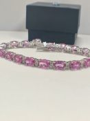 14ct White Gold Sapphire and Diamond bracelet featuring, 19 oval cut, pink Sapphires (15.93ct TSW)