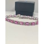 14ct White Gold Sapphire and Diamond bracelet featuring, 19 oval cut, pink Sapphires (15.93ct TSW)